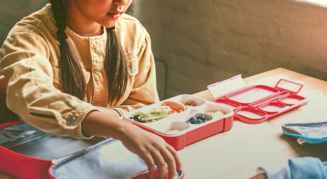 Child eating from lunch box